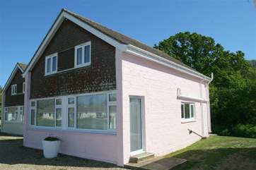 Curlew Cottage is located at the rear of the Salterns Village development, a short walk from the seafront
