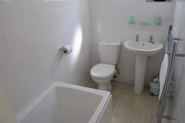 Downstairs bathroom with shower over bath
