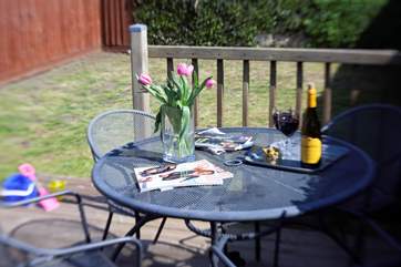 The garden has a small decked area, perfect for breakfast or an evening drink