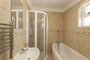 Family bathroom with shower over bath and separate shower cubicle