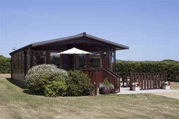 Hill Farm Lodge with surrounding lawns