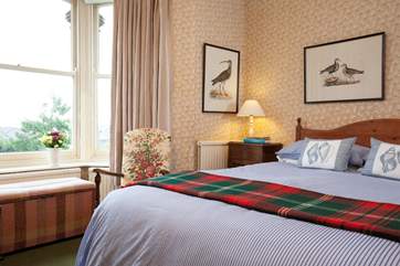 The comfortable double bedroom is spacious and light.
