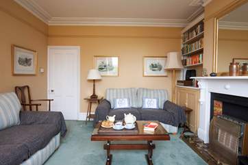 The sitting room boasts plenty of seating for the whole family.