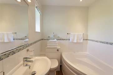 Ensuite bathroom with corner bath