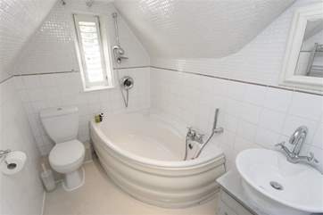 On the first floor there is a family bathroom with fitted shower.