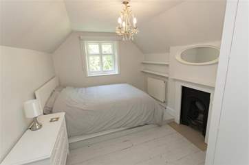 This double bedroom on the lower ground floor is spacious and inviting.