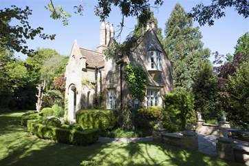 The house is surrounded by a secluded and well-maintained garden.