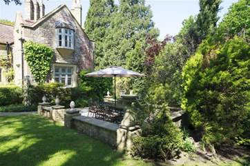 Dappled in shade, the patio and garden are incredibly inviting.