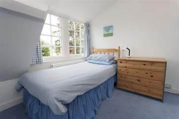 The single bedroom is in the eaves, the perfect hideaway for teenagers