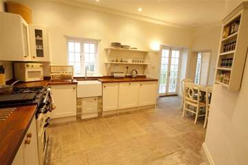 Traditional kitchen with doors onto Garden