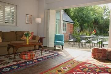 Lounge with bi-fold door onto patio