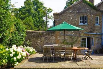 Large patio with outside dining furniture
