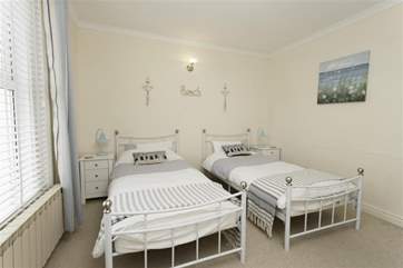The twin bedroom is light and airy