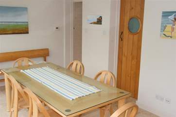 There is a utility room and wet room off the dining area