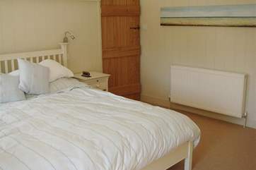 Master bedroom with super king size bed and en-suite toilet