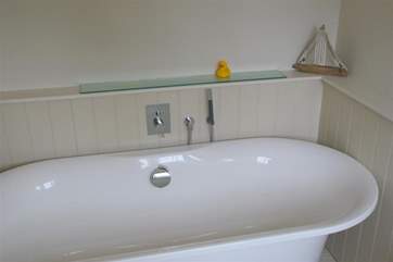 Family bathroom with hand held shower