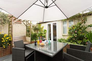 Enjoy al-freasco dining outside in the lovely sun trap