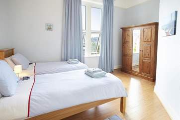 Light and airy twin bedroom with views to the rear