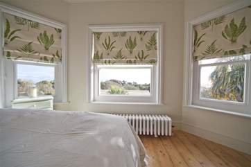 Enjoy the views from the main bedroom across the gardens and out to the sea