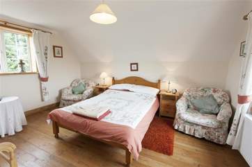 The main bedroom with views both sides across the countryside