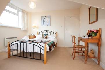 The master bedroom is spacious and comfortable.