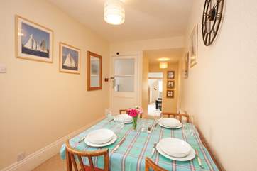 The larger dining area just beyond the kitchen provides ample seating for four.
