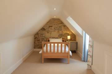 Twin bedroom in the loft of the main house, accessed by paddle style stairs