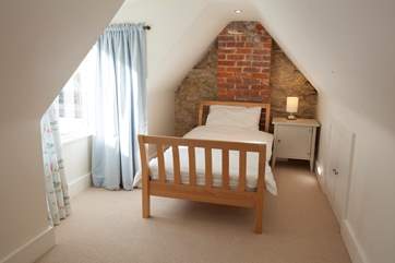 The second bed in the twin loft room of the main house