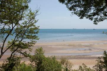 The extensive grounds overlook the beautiful and private beach.