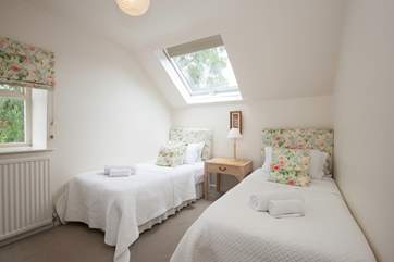 The sweet twin bedroom with sloping ceilings (may restrict head height).