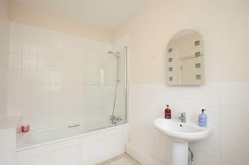 Take a relaxing bath or a quick morning shower in the bathroom.