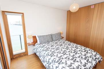 Bedroom 1 (with king-size bed) has direct access to the front deck.
