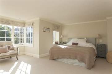 The spacious master bedroom with super king-size bed.