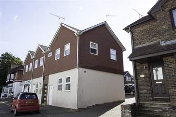 The exterior of the entire building. West Flatlet comprises the entire upper floor in the centre of the picture.