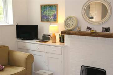 The main living area has a cosy fireplace and television.