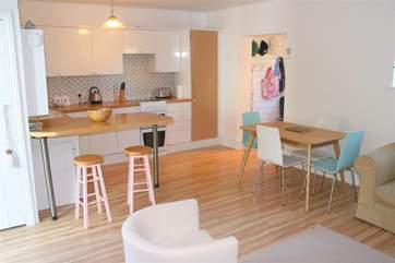 The kitchen area and breakfast bar. There is also a separate table and chairs.