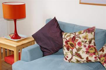 The soft furnishings make this such a cosy room.