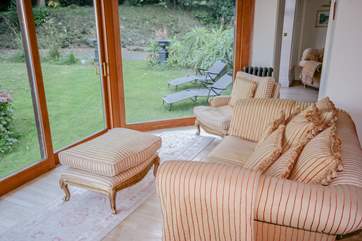 Sitting area with views across the garden and out to sea