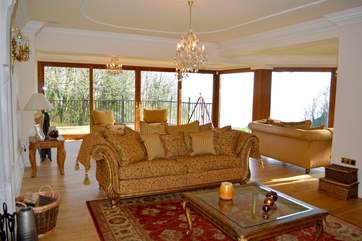 Large living area which leads onto decking with Sea views