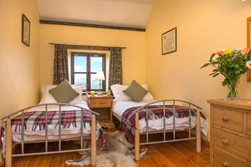 Comfy twin bedroom with uninterrupted views over the beautiful landscapes.