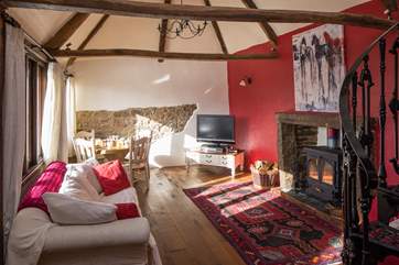 The dining and living area provide a comfortable and spacious place to sit back and cosy up in front of the rather large wood-burner.