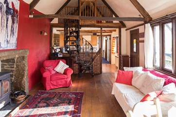 The bright and airy open plan living area. Please take care when using the spiral staircase.