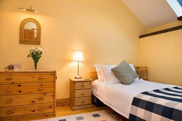 Twin bedroom, cosy and inviting.