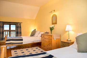 Delightful twin bedroom. Bright and spacious, with wonderful views over the rolling countryside which is your back garden.