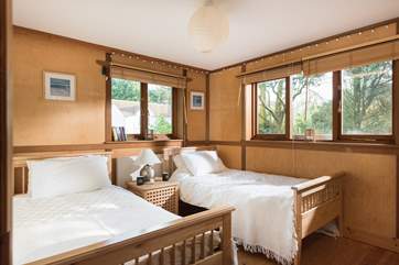 The twin bedroom is furnished with three foot single beds.