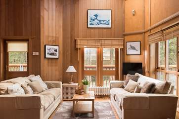 The living-room is furnished with comfy sofas to relax on.