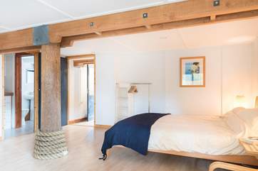 The exposed beams and pole are a real feature in this wonderful house.