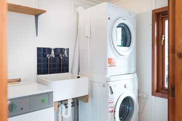 The utility room with washing machine, drier and useful sink is on the ground floor.