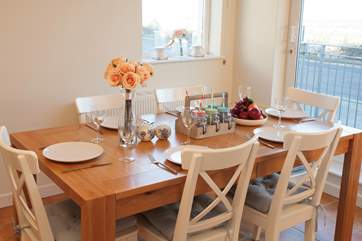 The dining-table extends to incorporate all guests when at full capacity.