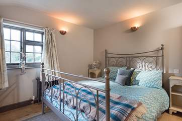 Dual-aspect bedroom 1 is furnished with a 6ft double bed.